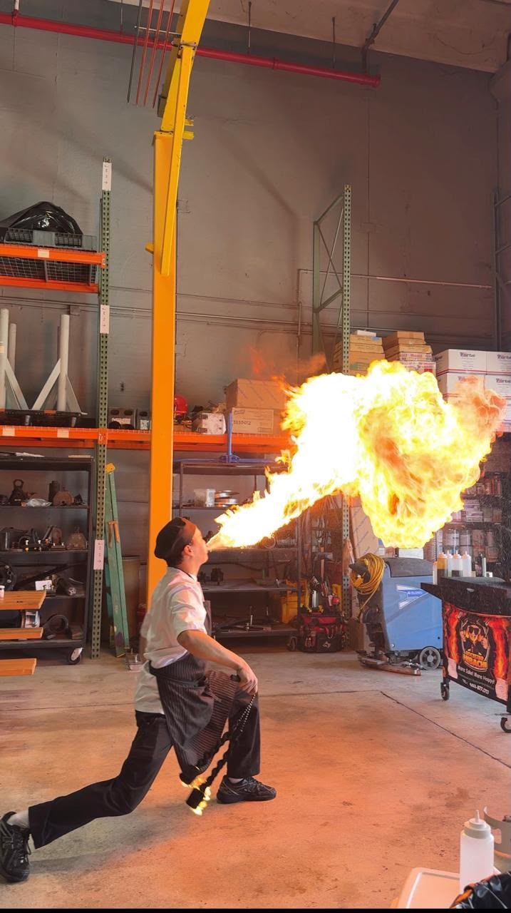Chef breathing fire at a private event