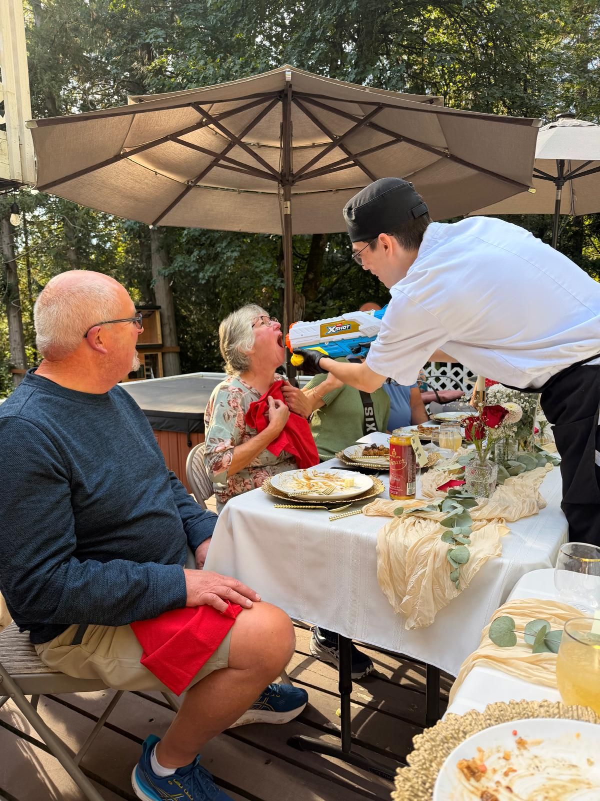 Chef cooking for guests outdoors