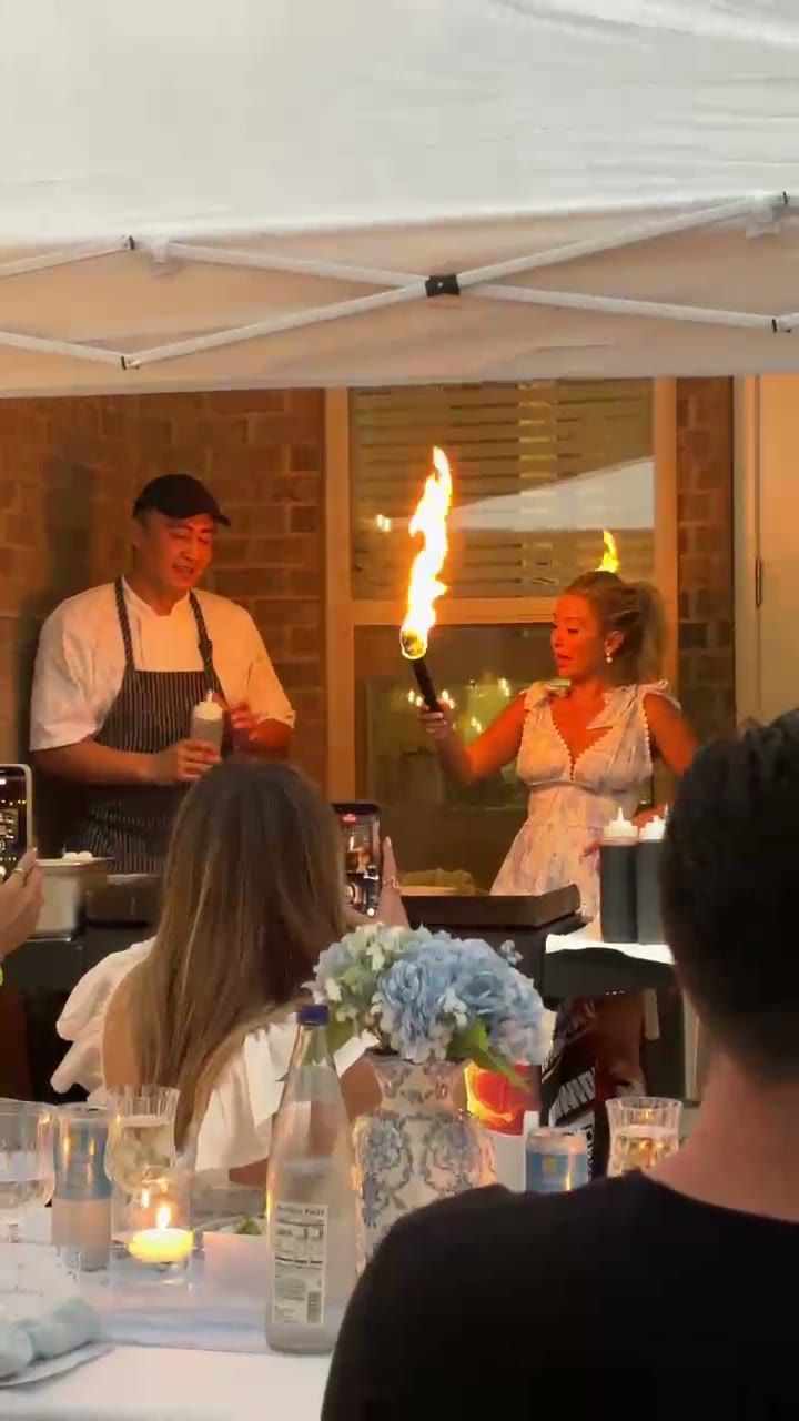 Party guests watching the fire show