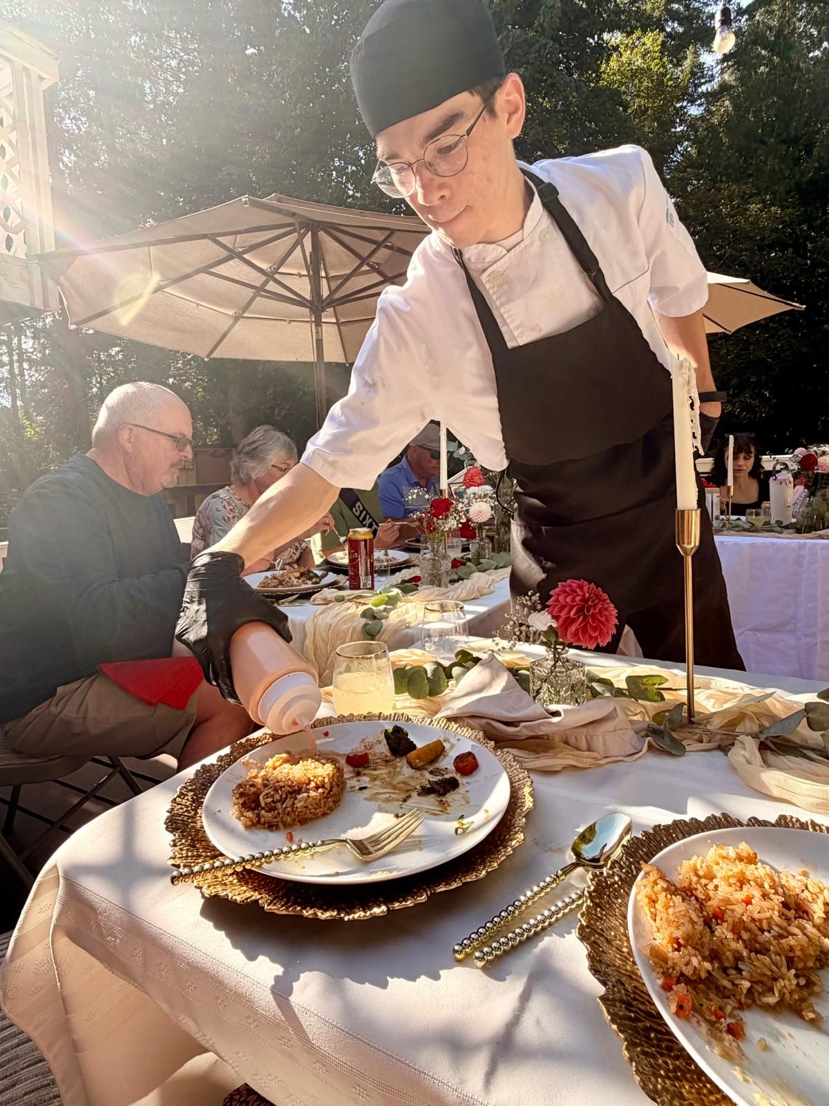 Chef cooking hibachi live at a private event