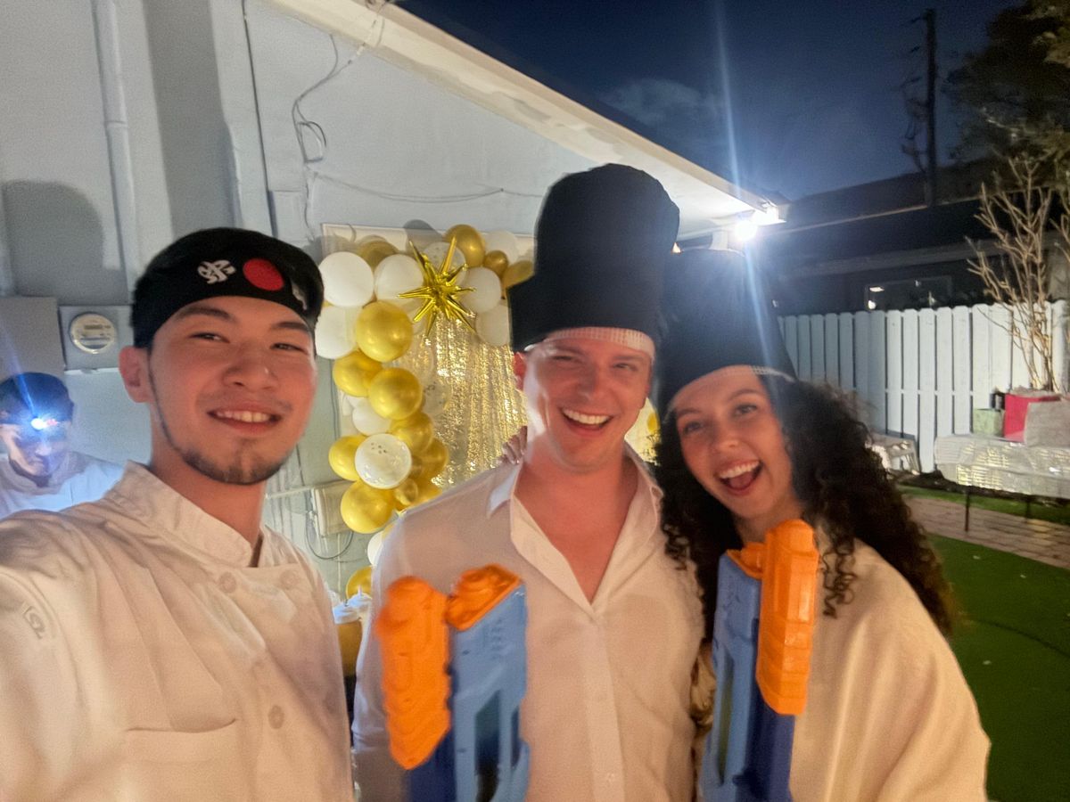 Happy guests with the chef at a private hibachi party